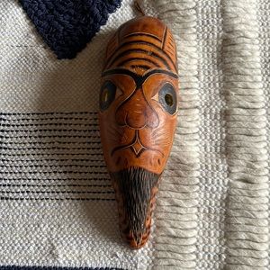 Mask of cat like face made from a gourd